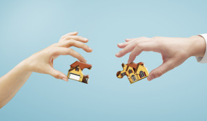 house puzzle in hands, closeup